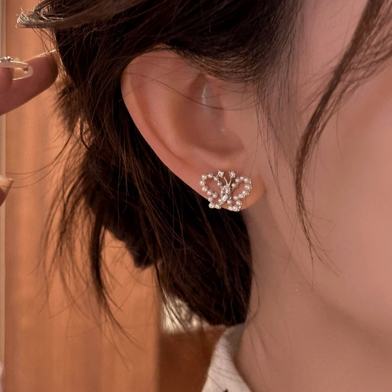 Close-up detail of the sparkling zircons and plating on the Butterfly Stud Earrings
