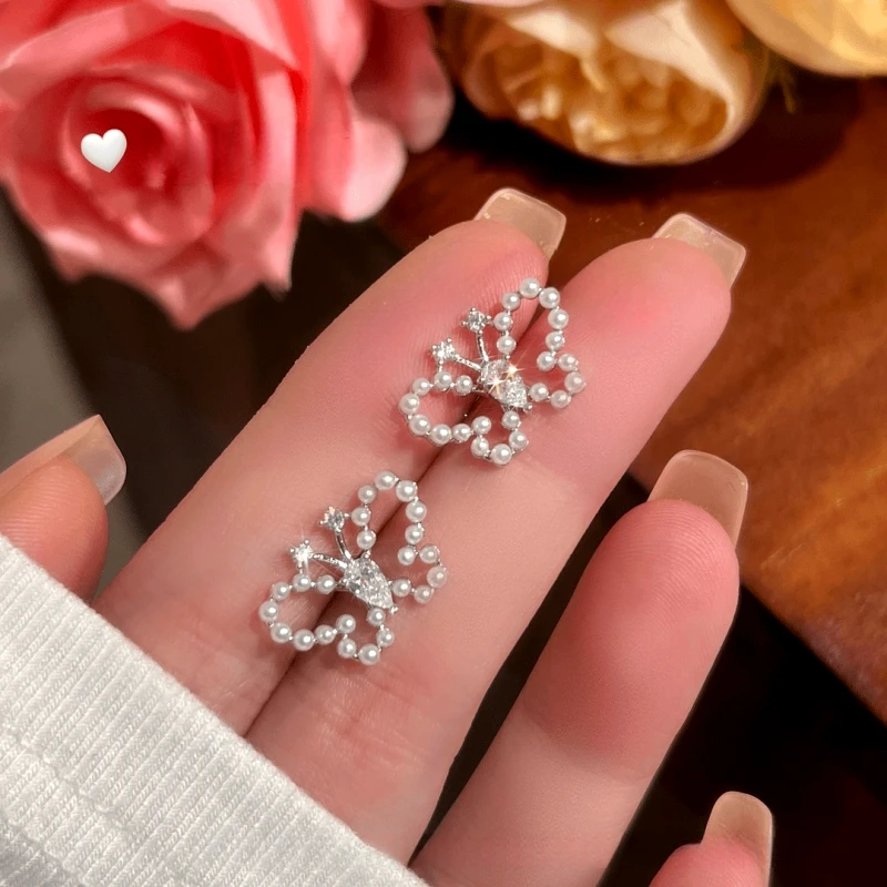 Angled view of the 14K Gold-Plated Elegant Zircon Butterfly Bead Stud Earrings