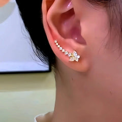 Model showcasing the dangle and style of the 14K Gold-Plated Elegant Zircon Butterfly Diamond Crawler Earrings