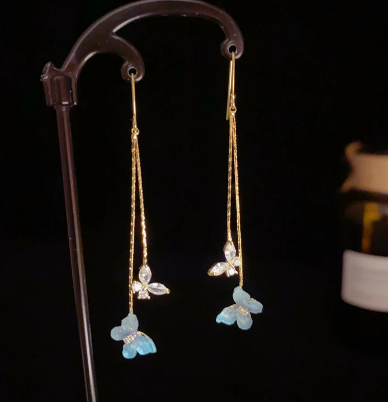 Model showcasing the dangle and style of the 14K Gold-Plated Elegant Zircon Butterfly Ear Hooks