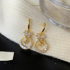 Close-up detail of the sparkling zircons and plating on the Butterfly Ear Hooks