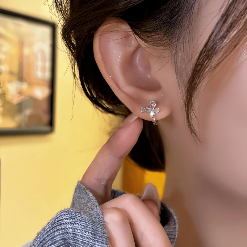 Close-up detail of the sparkling zircons and plating on the Butterfly Hoop Earrings