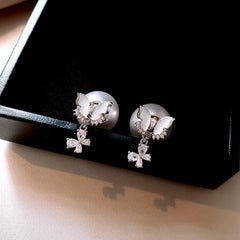 Close-up detail of the sparkling zircons and plating on the Butterfly Jacket Earrings