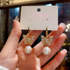 Close-up detail of the sparkling zircons and plating on the Pearl Ear Hooks