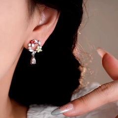 Model showcasing the dangle and style of the 14K Gold-Plated Elegant Zircon Butterfly Mushroom Earrings