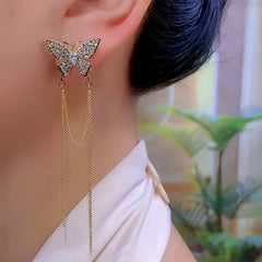 Model showcasing the dangle and style of the 14K Gold-Plated Elegant Zircon Butterfly Tassel Earrings