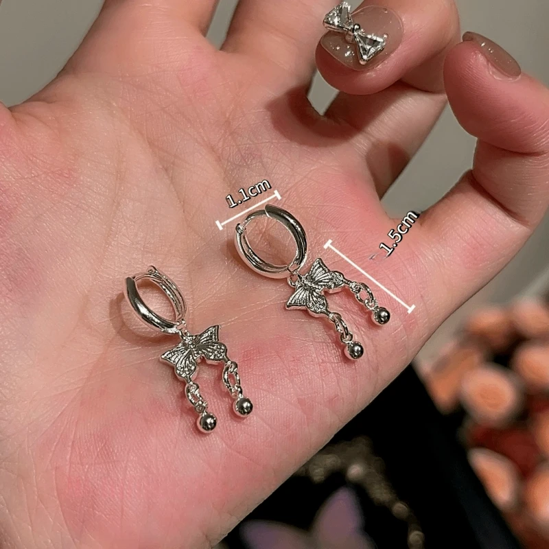 Angled view of the 14K Gold-Plated Elegant Zircon Butterfly Tassel Earrings