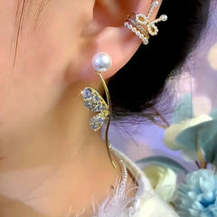 Close-up detail of the sparkling zircons and plating on the Butterfly Wing Earrings