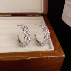 Angled view of the 14K Gold-Plated Elegant Zircon C-Shaped Earrings