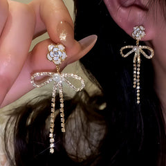 Angled view of the 14K Gold-Plated Elegant Zircon Camellia Pearl Bow Earrings