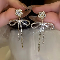 Close-up detail of the sparkling zircons and plating on the Camellia Pearl Earrings