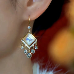 Close-up detail of the sparkling zircons and plating on the Cat's Eye Ear Hooks