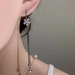 Close-up detail of the sparkling zircons and plating on the Cat's Eye Flower Ear Hooks