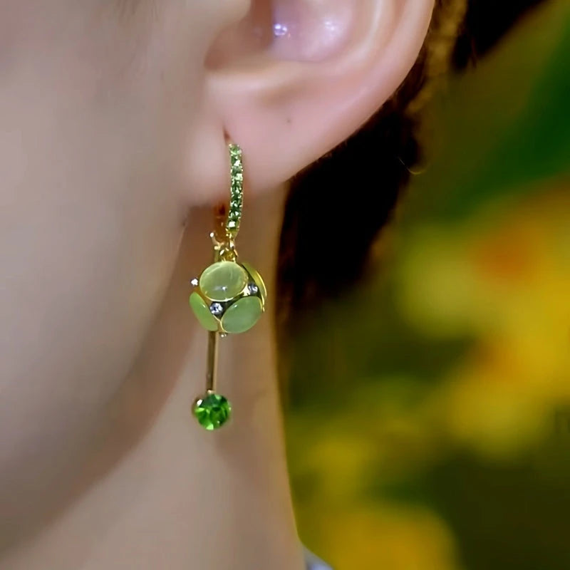 Close-up detail of the sparkling zircons and plating on the Cat's Eye Tassel Earrings