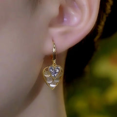 Close-up detail of the sparkling zircons and plating on the Double Heart Earrings