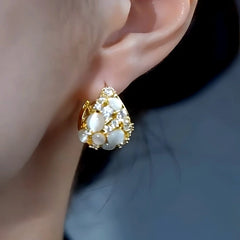 Close-up detail of the sparkling zircons and plating on the Water Drop Earrings