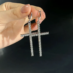 Model showcasing the dangle and style of the 14K Gold-Plated Elegant Zircon Cross Earrings