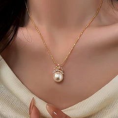 Close-up of the pendant and clasp on the Crown Pearl Necklace