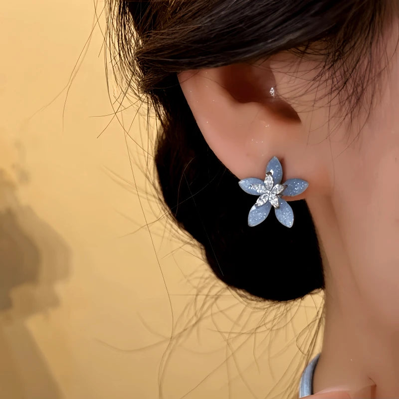 Close-up detail of the sparkling zircons and plating on the Flower Stud Earrings