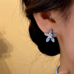 Close-up detail of the sparkling zircons and plating on the Flower Stud Earrings