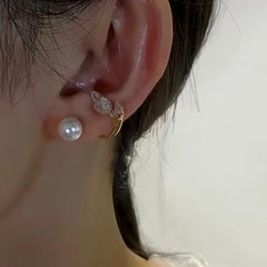 Model showcasing the dangle and style of the 14K Gold-Plated Elegant Zircon Crystal Pearl Earrings