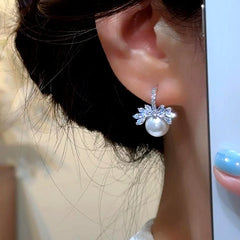 Model showcasing the dangle and style of the 14K Gold-Plated Elegant Zircon DIamond Bead Pearl Earrings