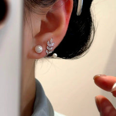 Close-up detail of the sparkling zircons and plating on the Pearl Jacket Earrings