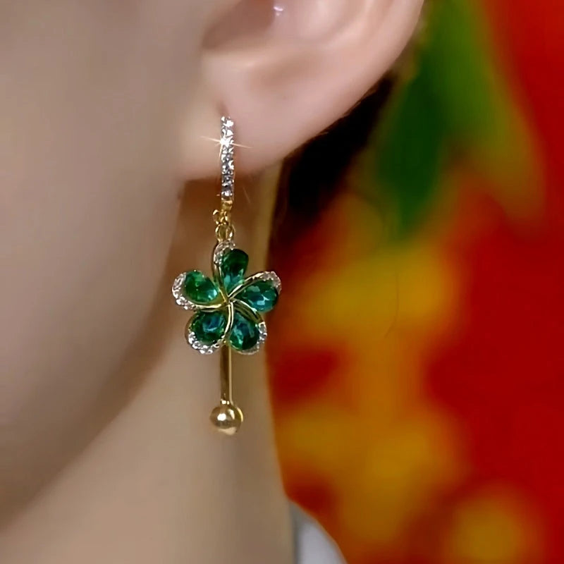Model showcasing the dangle and style of the 14K Gold-Plated Elegant Zircon Dark Green Petal-Flower Tassel Earrings