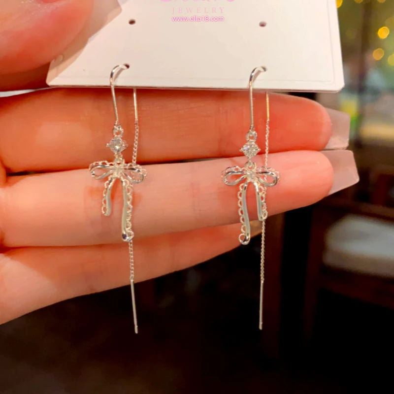 Angled view of the 14K Gold-Plated Elegant Zircon Diamond Bow Threader Earrings