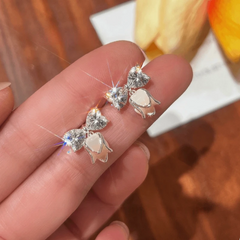 Angled view of the 14K Gold-Plated Elegant Zircon Diamond Bow Tulip Flower Earrings