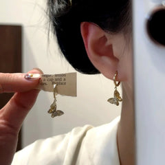 Close-up detail of the sparkling zircons and plating on the Butterfly Earrings