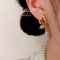 Close-up detail of the sparkling zircons and plating on the Butterfly Pearl Earrings