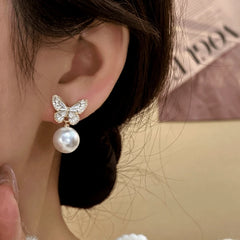 Model showcasing the dangle and style of the 14K Gold-Plated Elegant Zircon Diamond Butterfly Pearl Tassel Earrings