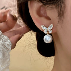 Close-up detail of the sparkling zircons and plating on the Butterfly Tassel Earrings