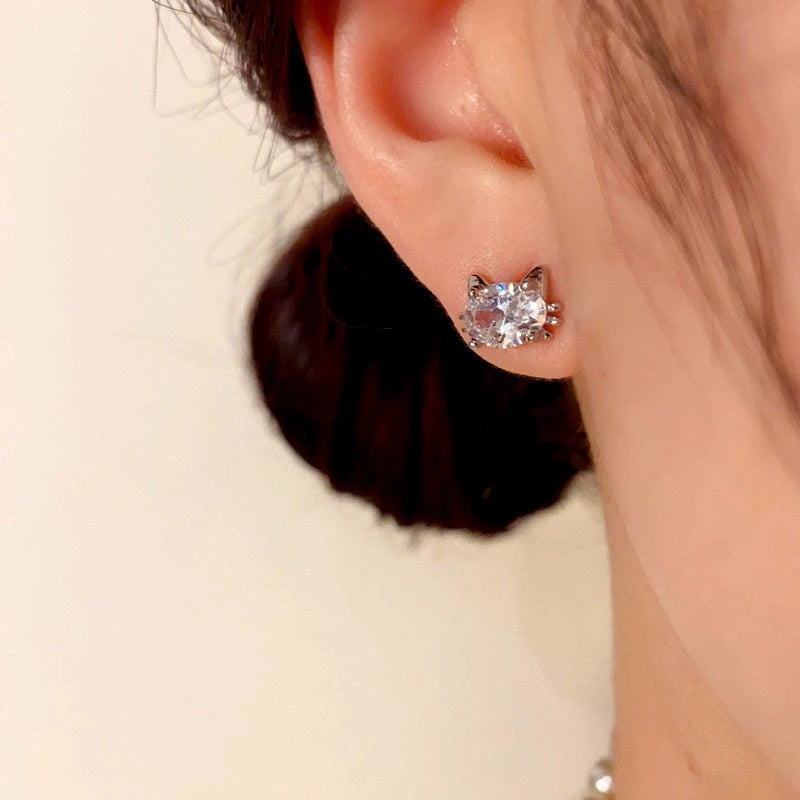 Model showcasing the dangle and style of the 14K Gold-Plated Elegant Zircon Diamond Cat Stud Earrings