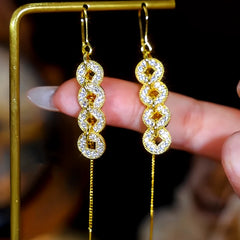 Angled view of the 14K Gold-Plated Elegant Zircon Diamond Coin Tassel Threader Earrings