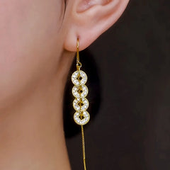 Model showcasing the dangle and style of the 14K Gold-Plated Elegant Zircon Diamond Coin Tassel Threader Earrings