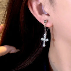 Close-up detail of the sparkling zircons and plating on the Cross Tassel Earrings