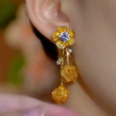 Model showcasing the dangle and style of the 14K Gold-Plated Elegant Zircon Diamond FLower Mesh Rose Tassel Earrings