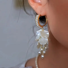 Close-up detail of the sparkling zircons and plating on the Pearl Drop Earrings