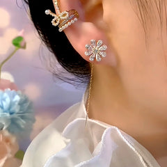 Model showcasing the dangle and style of the 14K Gold-Plated Elegant Zircon Diamond Flower Threader Earrings
