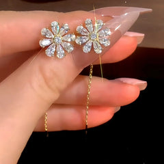 Angled view of the 14K Gold-Plated Elegant Zircon Diamond Flower Threader Earrings