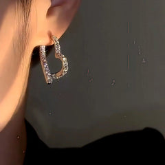 Close-up detail of the sparkling zircons and plating on the Heart Dangle Earrings