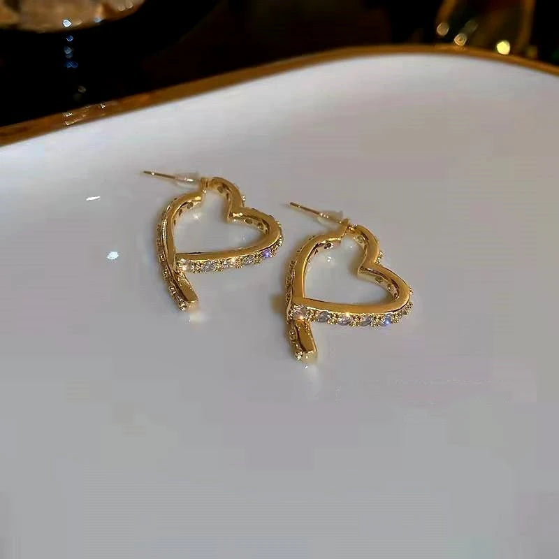 Angled view of the 14K Gold-Plated Elegant Zircon Diamond Heart Earrings