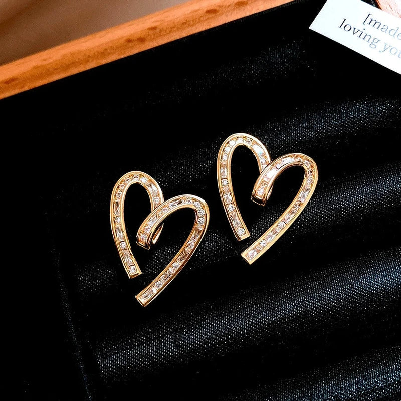 Angled view of the 14K Gold-Plated Elegant Zircon Diamond Heart Stud Earrings