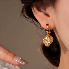 Model showcasing the dangle and style of the 14K Gold-Plated Elegant Zircon Diamond Iris Pearl Earrings