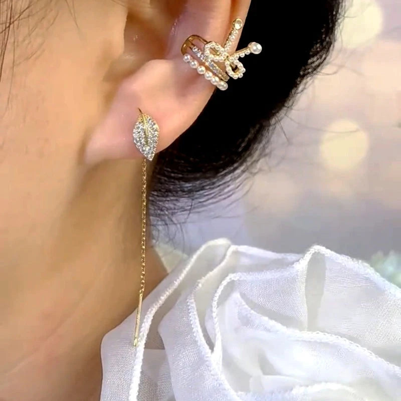 Close-up detail of the sparkling zircons and plating on the Leaf Threader Earrings