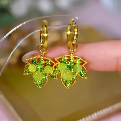 Angled view of the 14K Gold-Plated Elegant Zircon Diamond Maple Leaf Earrings