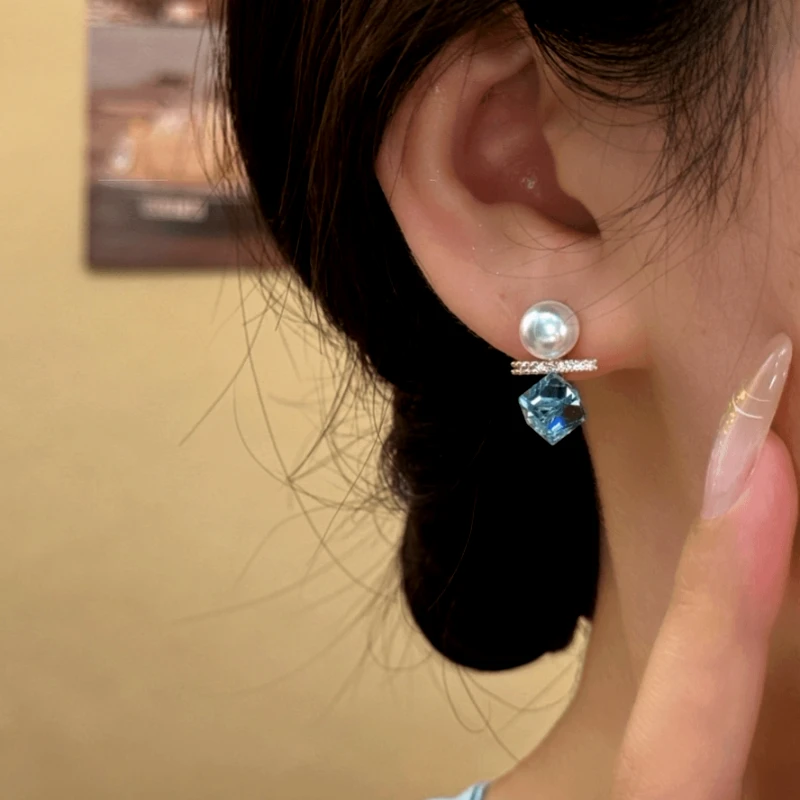 Close-up detail of the sparkling zircons and plating on the Pearl Earrings