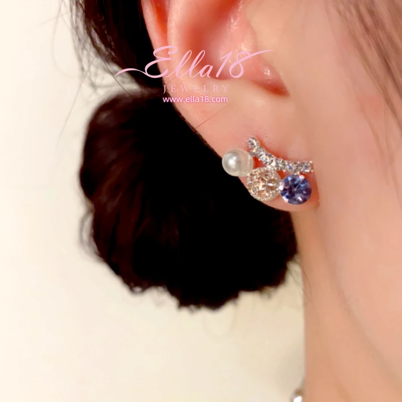 Close-up detail of the sparkling zircons and plating on the Pearl Studs